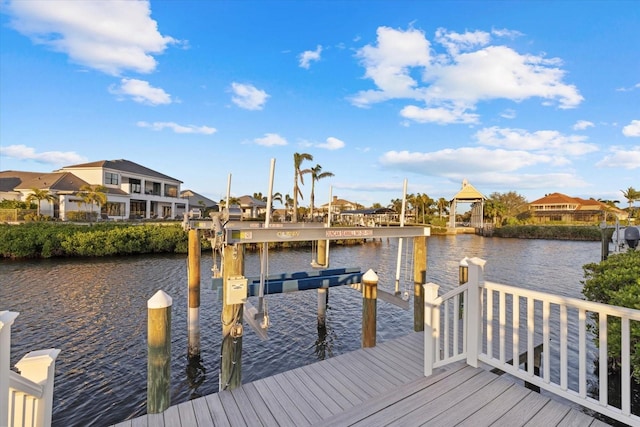 dock area featuring a residential view, a water view, and boat lift