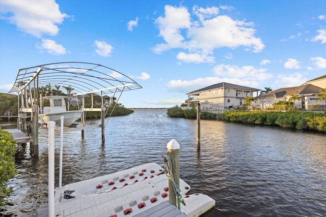 dock area featuring a water view and boat lift