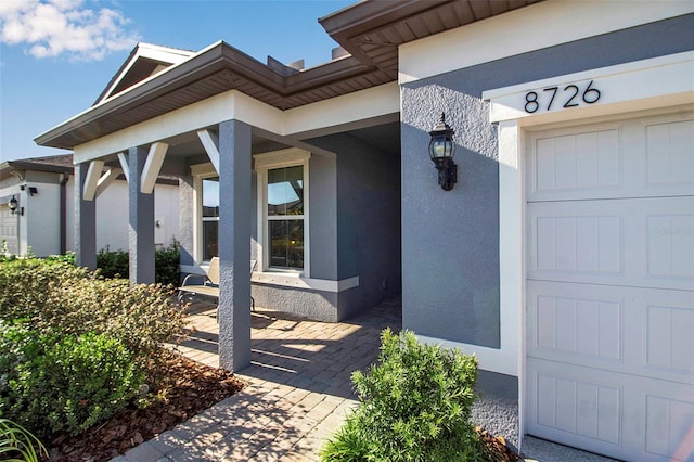 doorway to property with stucco siding