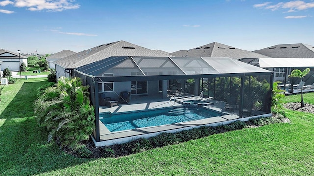 view of swimming pool featuring glass enclosure, a yard, a patio area, and a pool with connected hot tub