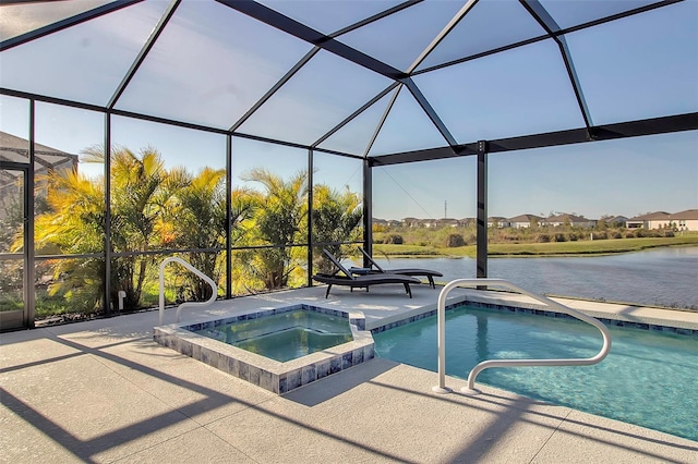 view of swimming pool with glass enclosure, a patio, a water view, and a pool with connected hot tub