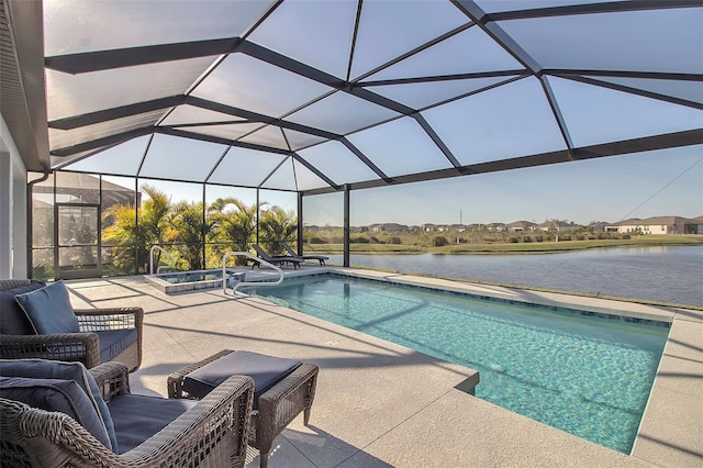 pool featuring a patio area, glass enclosure, and a water view