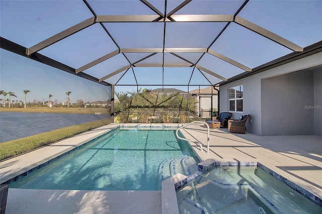 view of pool featuring a lanai, a patio area, and a pool with connected hot tub