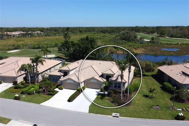 birds eye view of property featuring a residential view and a water view