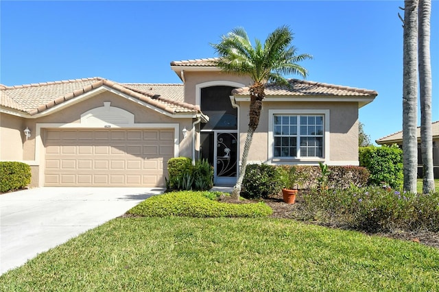 view of front of home with a front yard, driveway, stucco siding, a garage, and a tiled roof