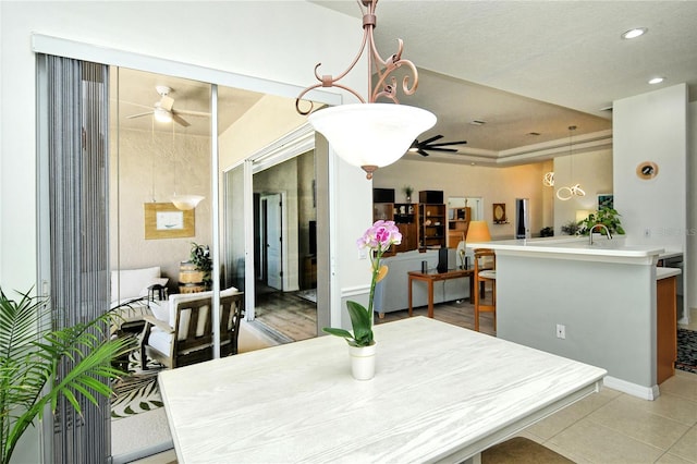 dining area with light tile patterned floors, a ceiling fan, and recessed lighting