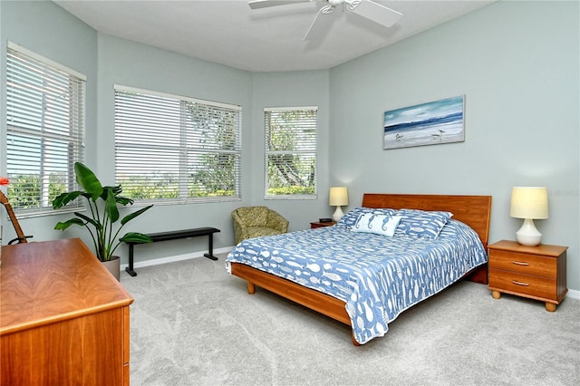 bedroom with carpet flooring, baseboards, and ceiling fan