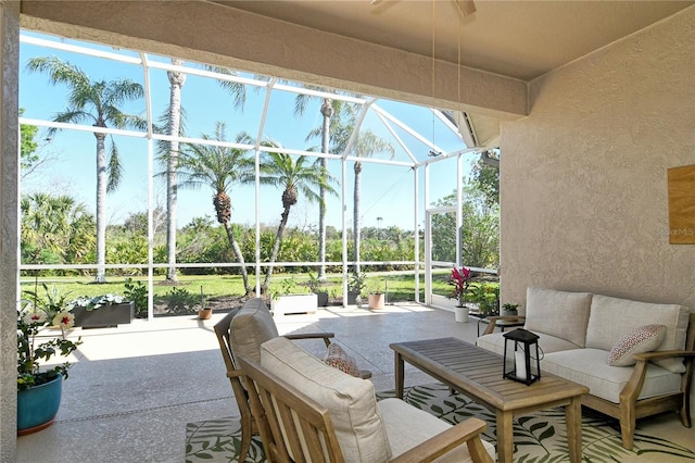 view of patio featuring an outdoor living space and a lanai