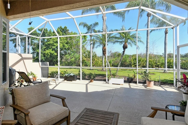 view of patio with glass enclosure