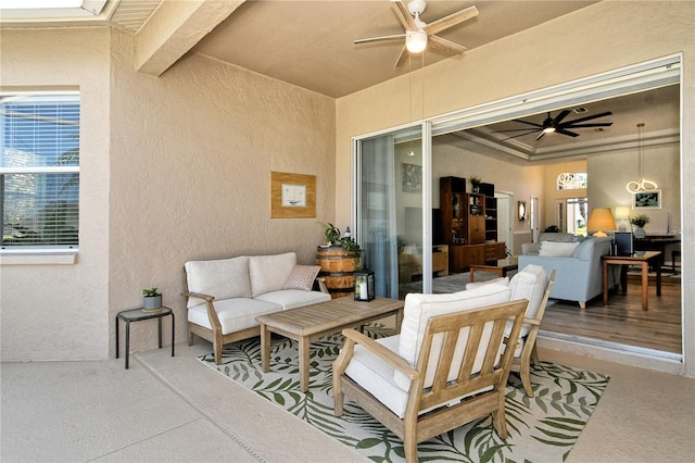 view of patio with an outdoor living space and a ceiling fan