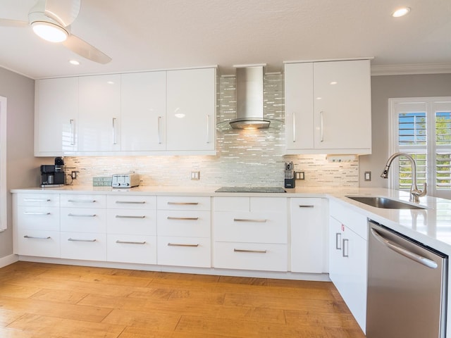 kitchen featuring a sink, modern cabinets, wall chimney range hood, and stainless steel dishwasher