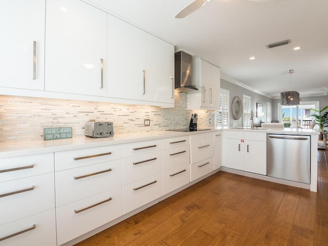 kitchen featuring visible vents, dishwasher, modern cabinets, and wall chimney exhaust hood