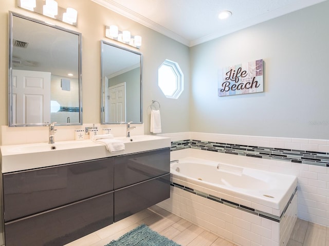 full bathroom featuring visible vents, a garden tub, ornamental molding, a sink, and double vanity