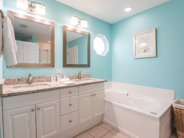 full bathroom with a sink, visible vents, a garden tub, and tile patterned flooring