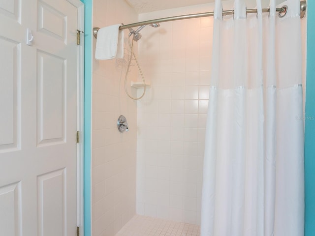 bathroom with a shower stall