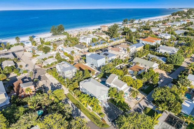 birds eye view of property featuring a beach view, a residential view, and a water view