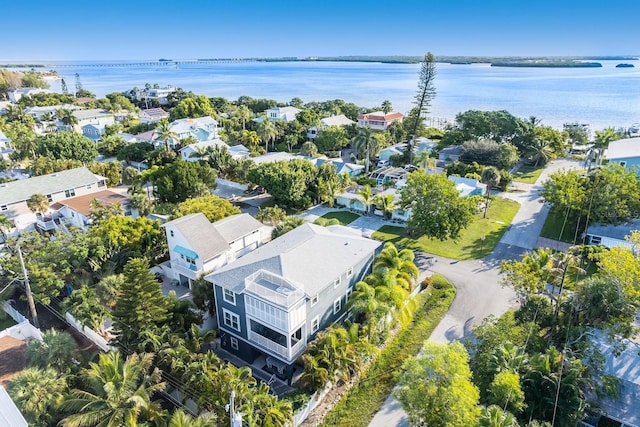 birds eye view of property featuring a residential view and a water view