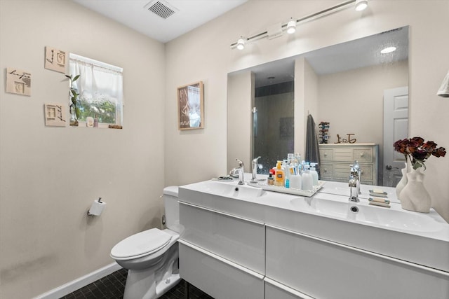 full bathroom featuring a sink, visible vents, baseboards, and toilet