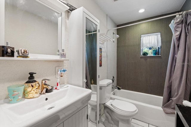 full bath featuring shower / bath combo with shower curtain, toilet, and vanity