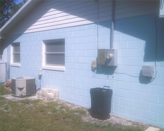 view of side of home featuring central AC