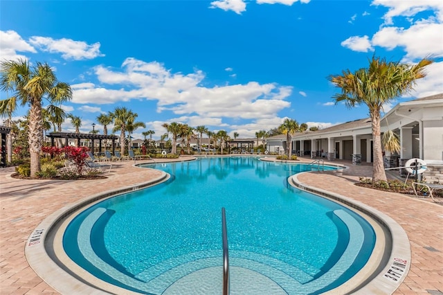 community pool with a patio area