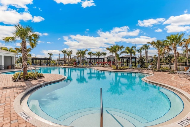 pool featuring a gazebo and a patio