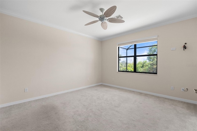 unfurnished room with crown molding, a ceiling fan, baseboards, and light carpet