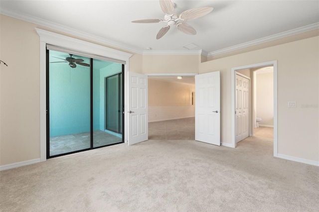 unfurnished bedroom with a closet, carpet flooring, and ornamental molding