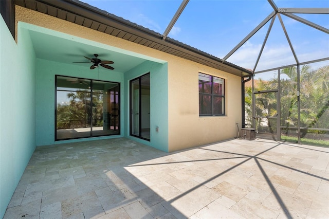 view of patio / terrace with glass enclosure and ceiling fan