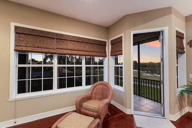 living area featuring wood finished floors and baseboards