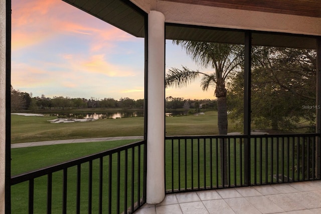 sunroom / solarium with a water view