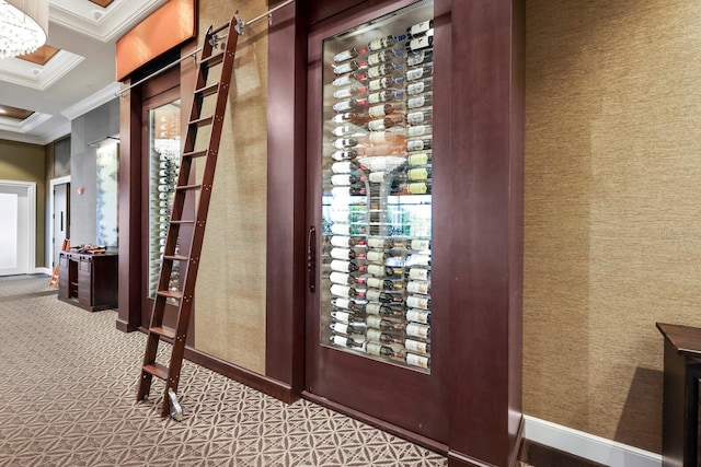 wine area with baseboards, carpet, ornamental molding, and wallpapered walls