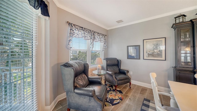 office featuring visible vents, baseboards, crown molding, and wood finish floors