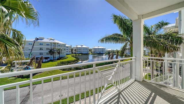 balcony featuring a water view