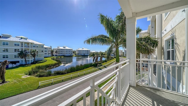 balcony featuring a water view