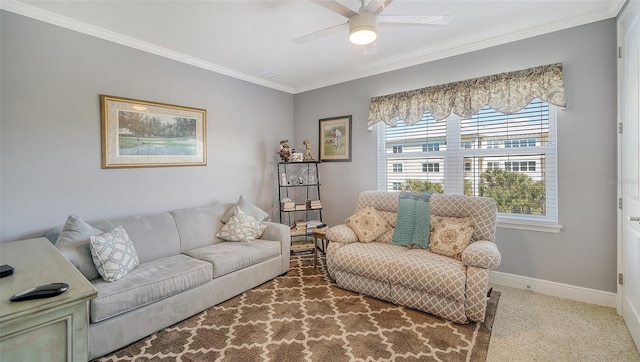 carpeted living room featuring baseboards, crown molding, and ceiling fan