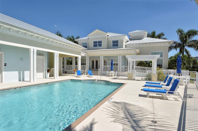 community pool featuring a patio, fence, and a pergola