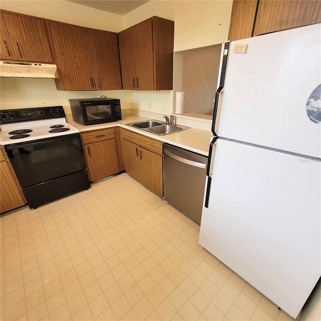 kitchen featuring freestanding refrigerator, electric range oven, under cabinet range hood, black microwave, and dishwasher