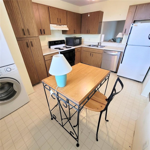 kitchen with freestanding refrigerator, range with electric cooktop, under cabinet range hood, black microwave, and stainless steel dishwasher