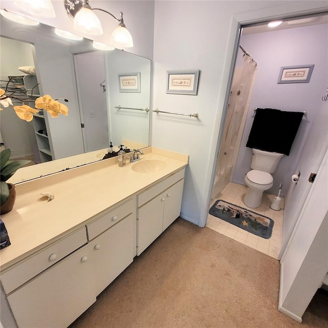 full bathroom with tile patterned floors, toilet, and vanity