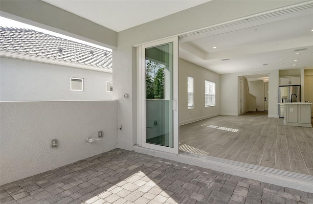 bathroom featuring recessed lighting, baseboards, and wood finished floors