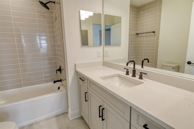 bathroom with tile patterned flooring, toilet, vanity, and shower / bath combination