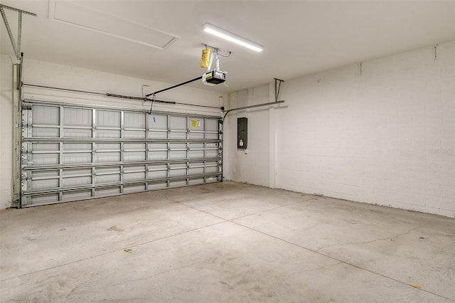 garage with electric panel and a garage door opener