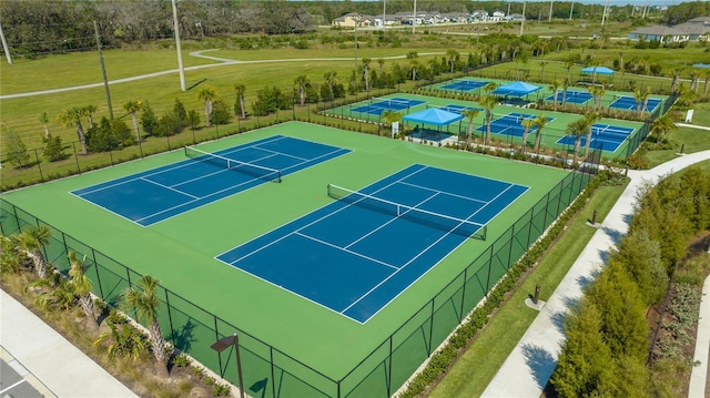 view of tennis court with fence