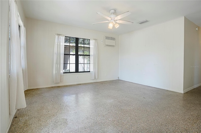 124 E 119th Ave, Tampa, FL 33612 - spare room with an AC wall unit, visible vents, ceiling fan, and speckled floor