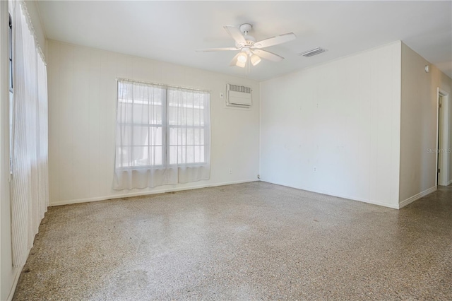 124 E 119th Ave, Tampa, FL 33612 - unfurnished room with speckled floor, ceiling fan, visible vents, and an AC wall unit