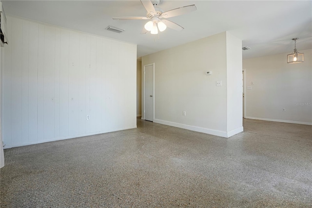 124 E 119th Ave, Tampa, FL 33612 - spare room featuring baseboards, visible vents, ceiling fan, and speckled floor