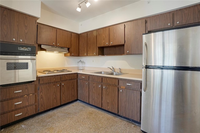 124 E 119th Ave, Tampa, FL 33612 - kitchen with light countertops, a sink, appliances with stainless steel finishes, and under cabinet range hood