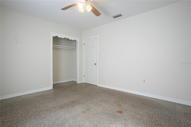 124 E 119th Ave, Tampa, FL 33612 - unfurnished bedroom with a closet, speckled floor, baseboards, visible vents, and ceiling fan