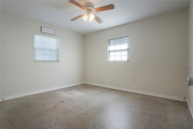 124 E 119th Ave, Tampa, FL 33612 - spare room featuring baseboards and a ceiling fan